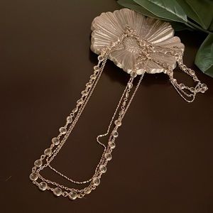 Multi strand gold necklace with clear beads